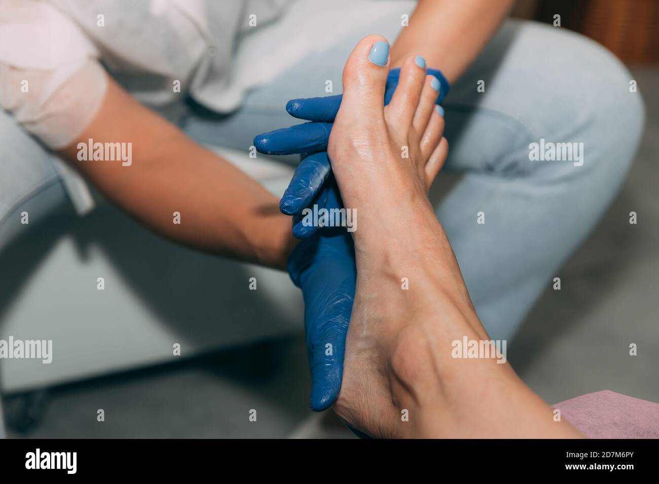 Closeup of Pedicure in salon. Foot care treatment and nail. Foot