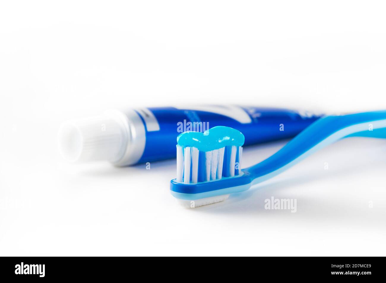 Blue tooth brush in glass. Isolated on white background Stock Photo - Alamy