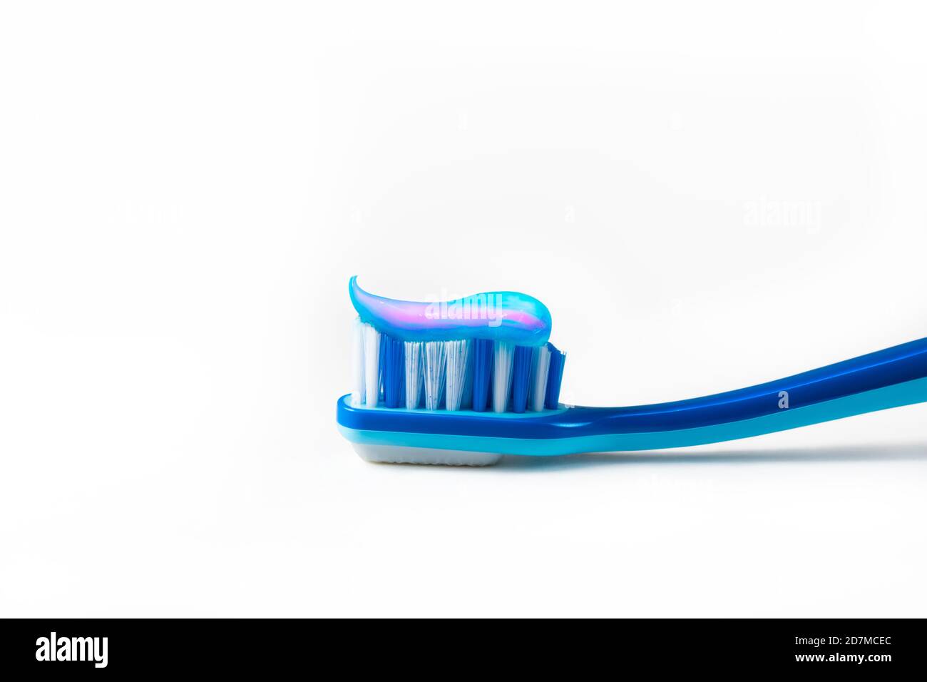 Blue tooth brush in glass. Isolated on white background Stock Photo - Alamy