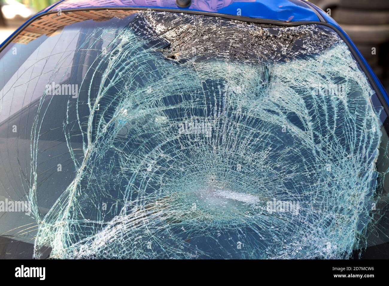 a blue car with a damaged windshield in a traffic accident. Stock Photo
