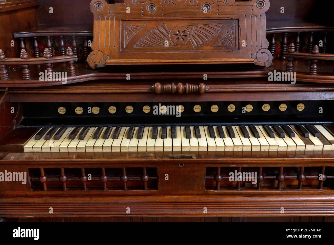 Close-up of beautiful vintage wooden harmonium with carved elements Stock Photo