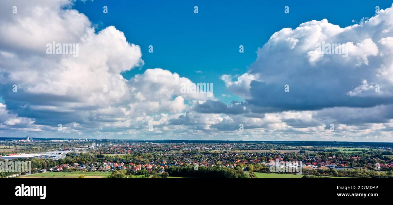 Cloudy dramatic sky over a suburb of Wolfsburg, Germany, aerial view Stock Photo