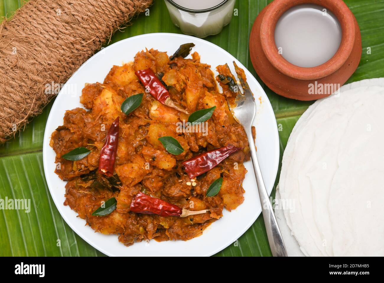 Kerala beef with parotta porotta roti. beef fry beef curry kerala style.  Indian beef curry, kappa tapioca cassava beef curry Spicy Kerala beef curry  Stock Photo - Alamy