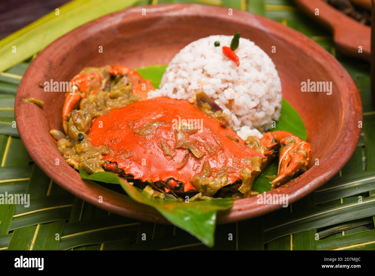 Spicy hot Kerala fish curry, Indian  fish curry popular in Goan Bengali and Sri lanka. Lankan fish curry. red curry fried fish vindaloo. crab roast Stock Photo