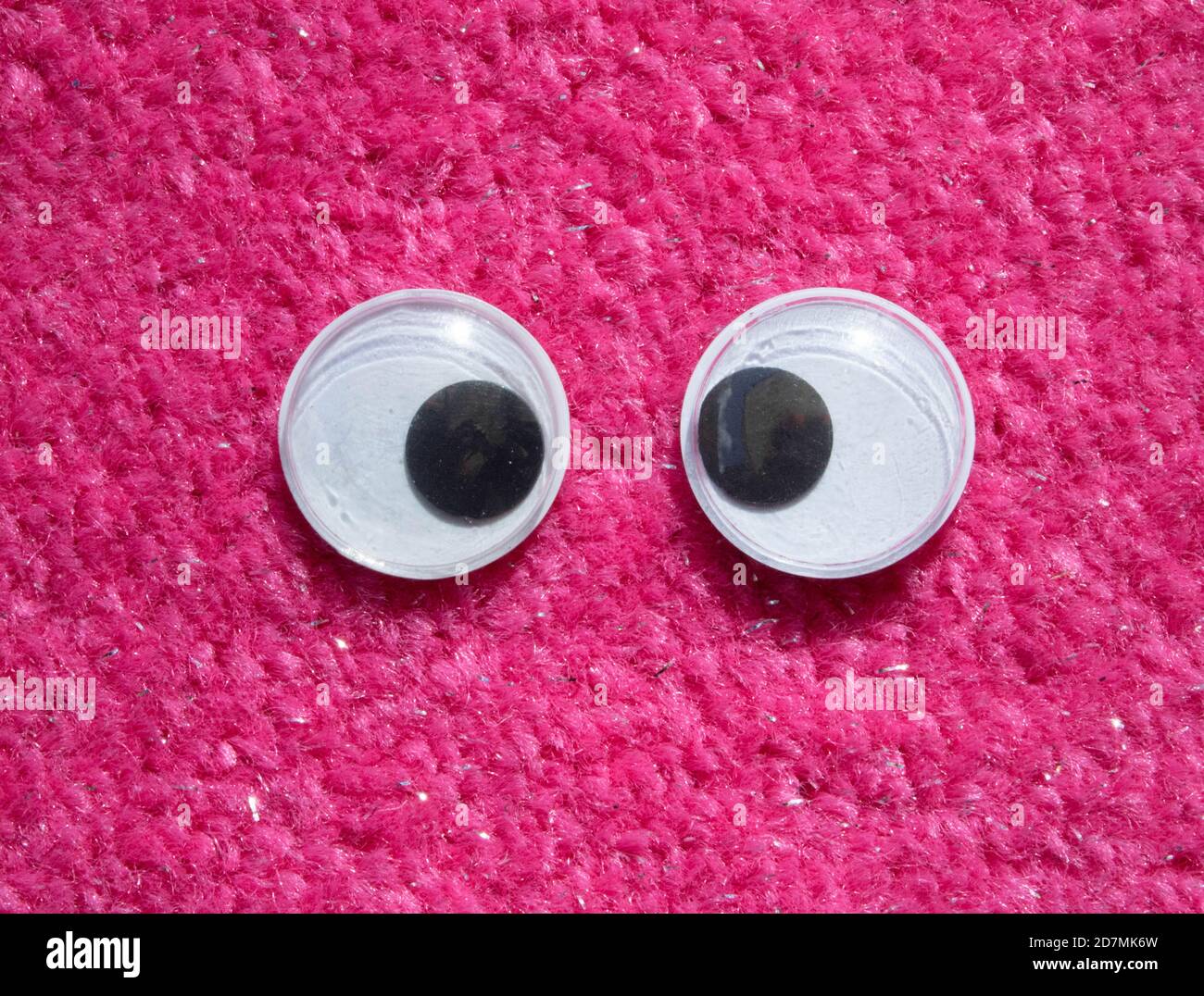 Funny Wiggle Google Eyes on Fabric Silly Fur Carpet Background Stock Photo  - Alamy