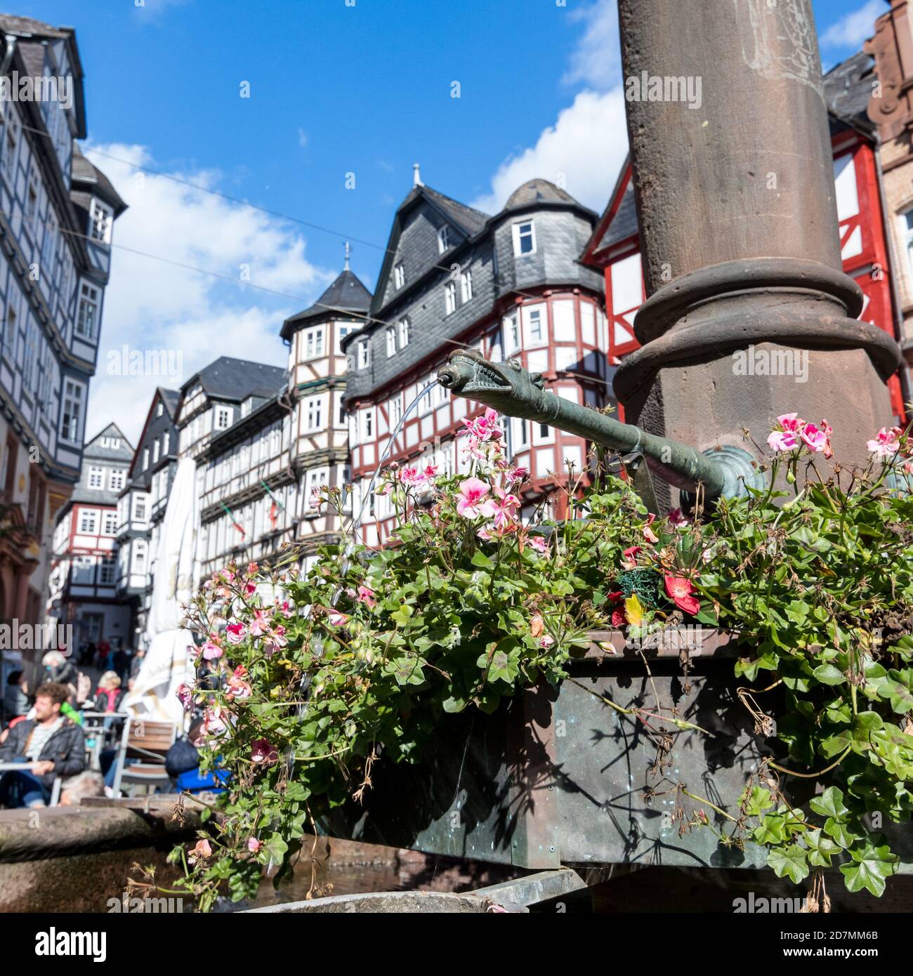 Drinking coffee on the market square in Marburg Stock Photo