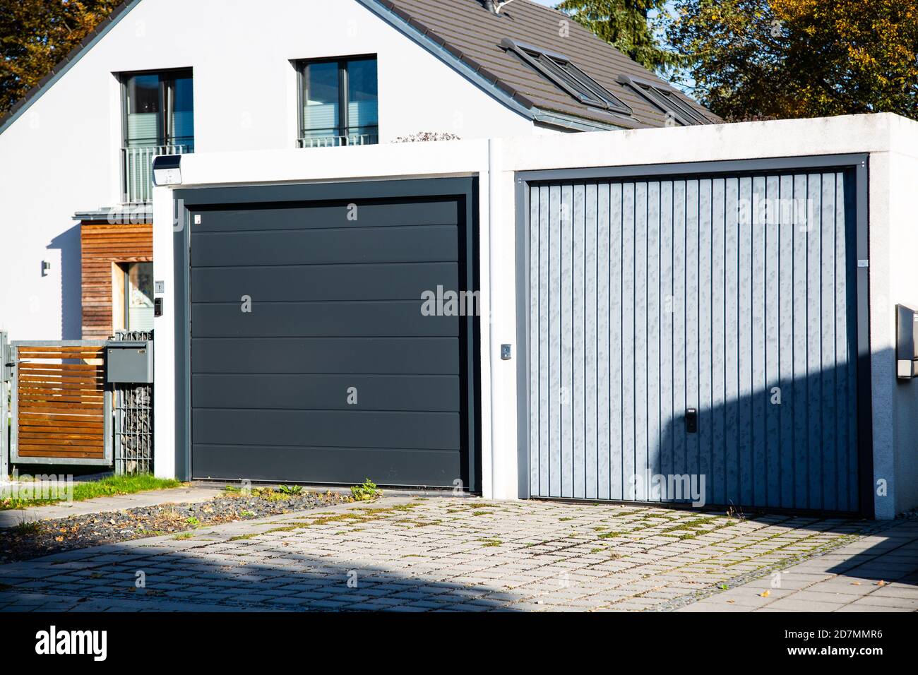 two different garage doors side by side Stock Photo