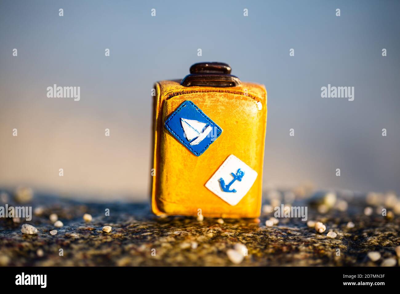 Suitcase on the beach, suitcase, blue background, dream trip, travel