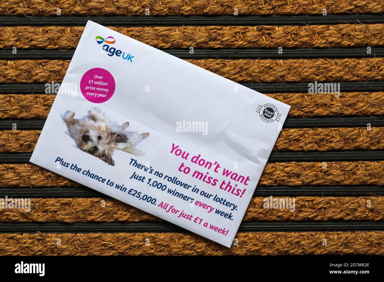 Post mail on doormat - Age UK weekly lottery Stock Photo