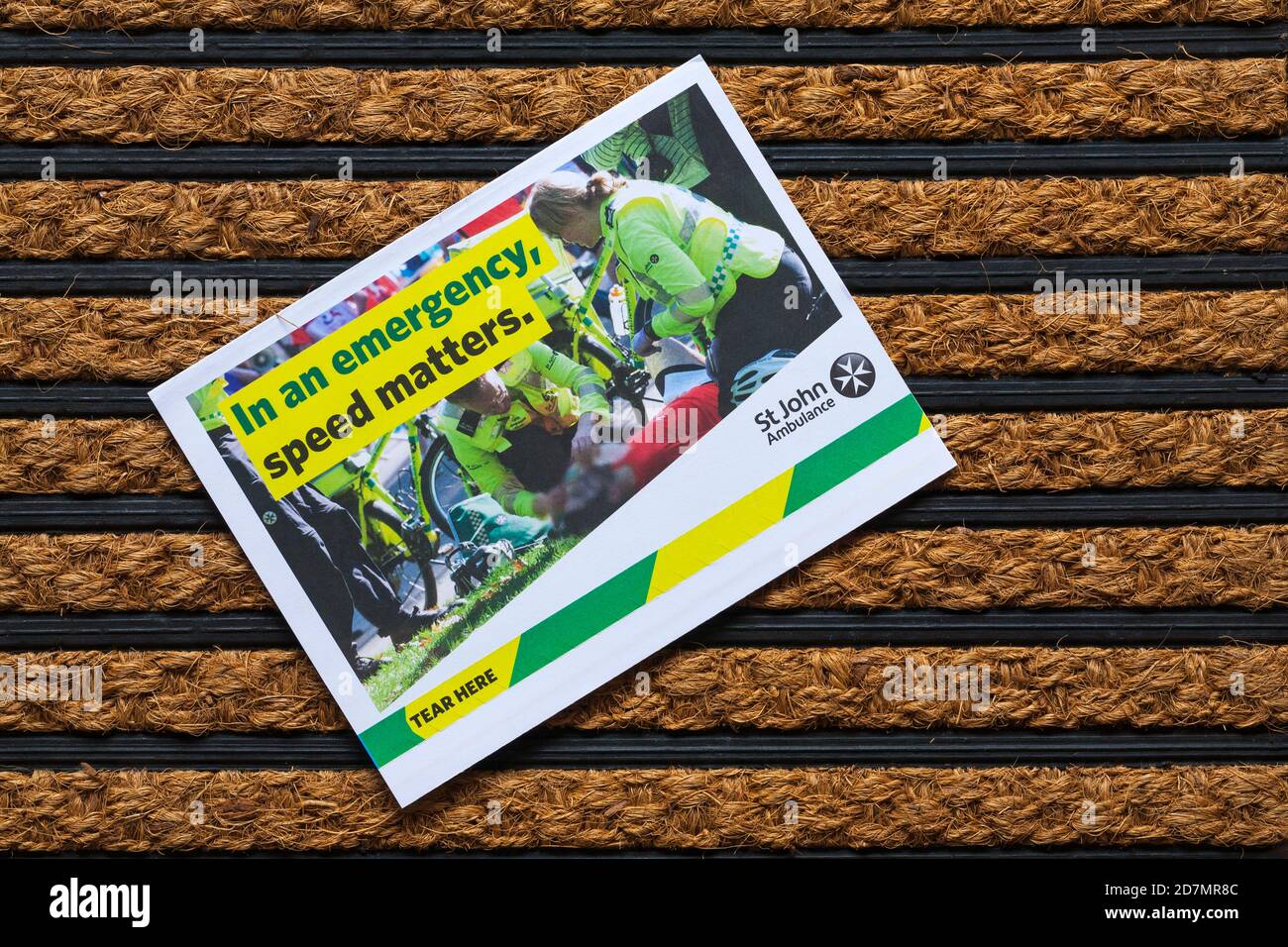 Post mail on doormat - appeal from St John Ambulance, in an emergency speed matters Stock Photo