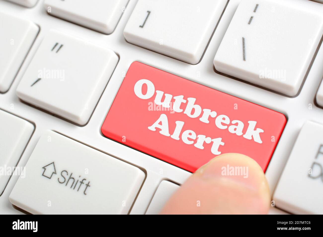Pressing red outbreak alert key on keyboard Stock Photo