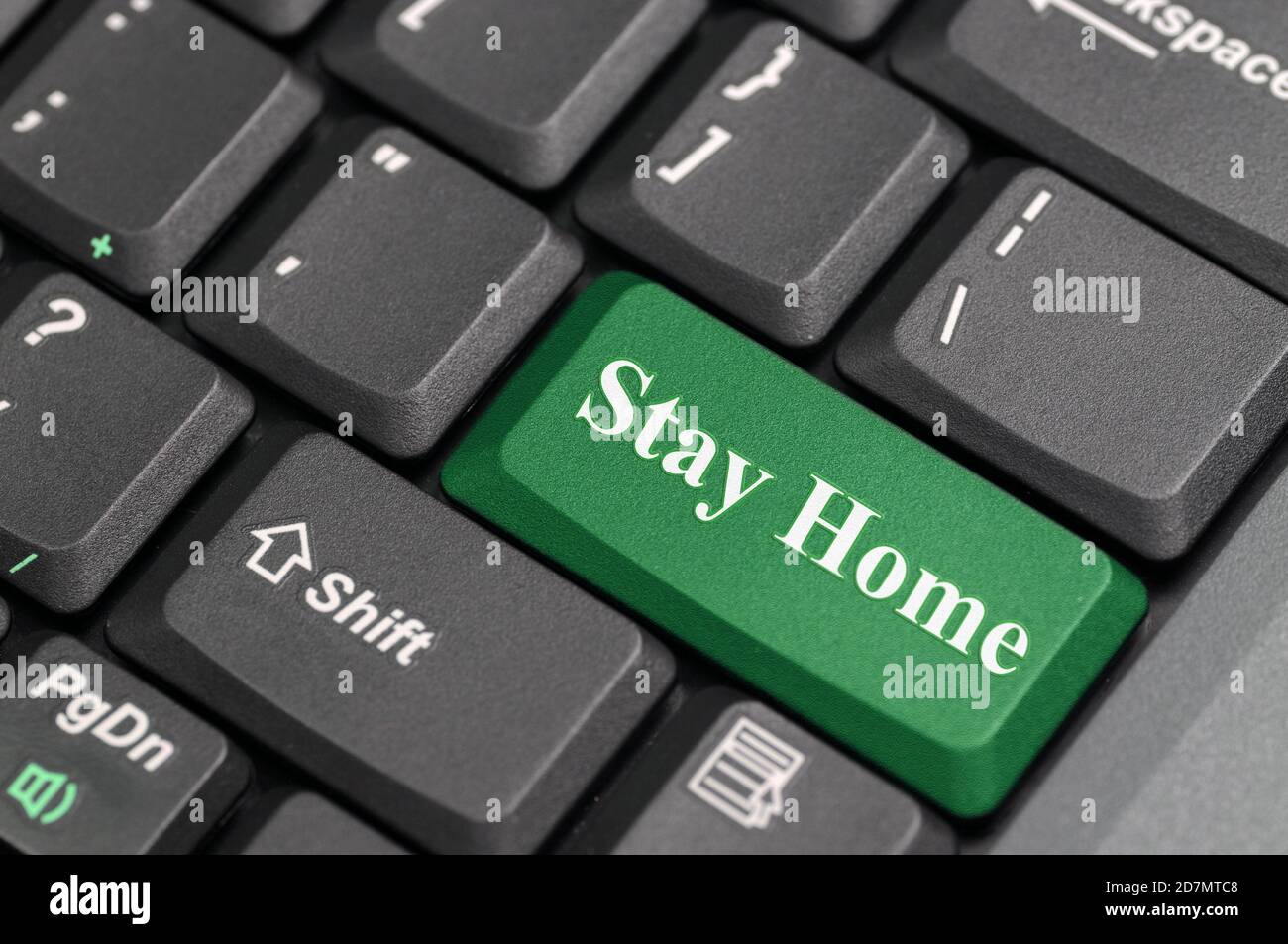 Stay home key on keyboard Stock Photo