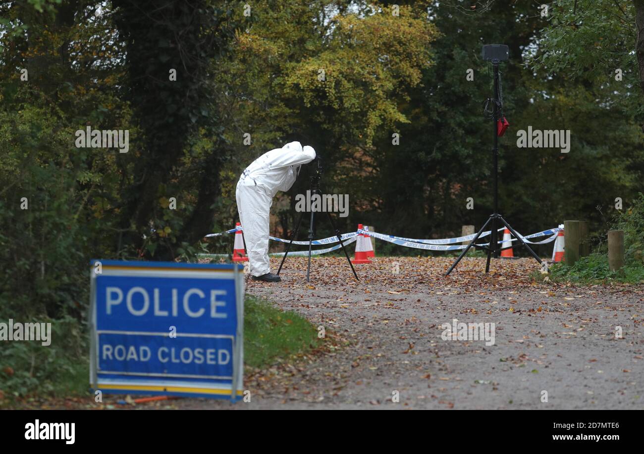 Forensic investigators at Watlington Hill in Oxfordshire after the body of a woman was discovered at the National Trust estate, a man has been arrested on suspicion of murder and is being treated for serious injuries, police said. Stock Photo