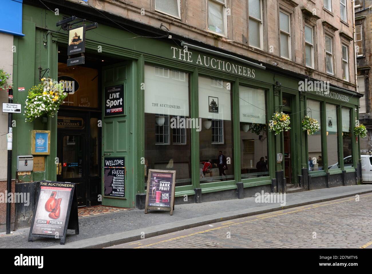 The renowned Auctioneers public bar advertising live sport, in Glasgow