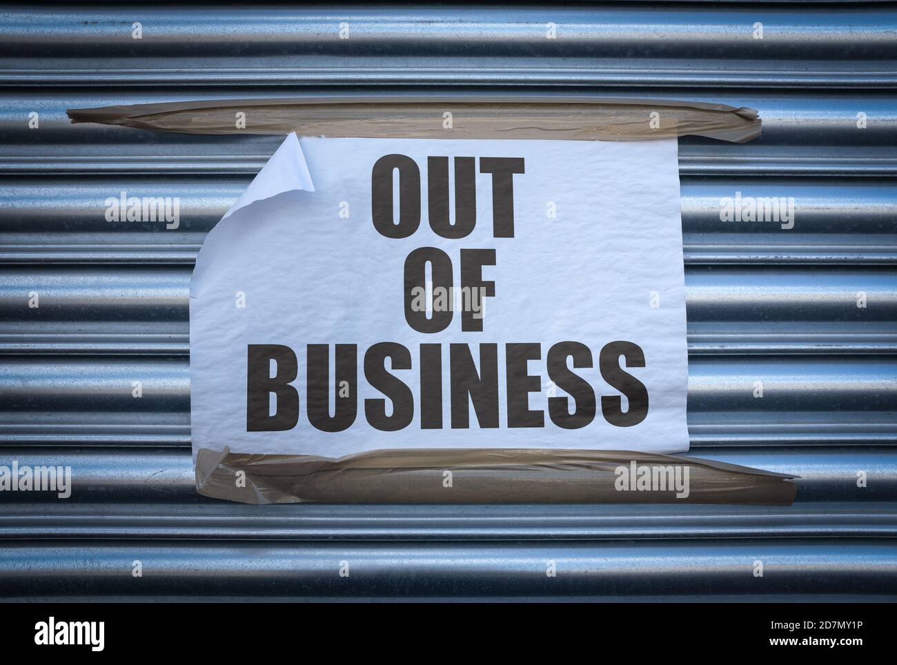 Grungy Out Of Business Sign On Some Old Store Shutters, A Consequence Of The 2020 COVID Pandemic Stock Photo