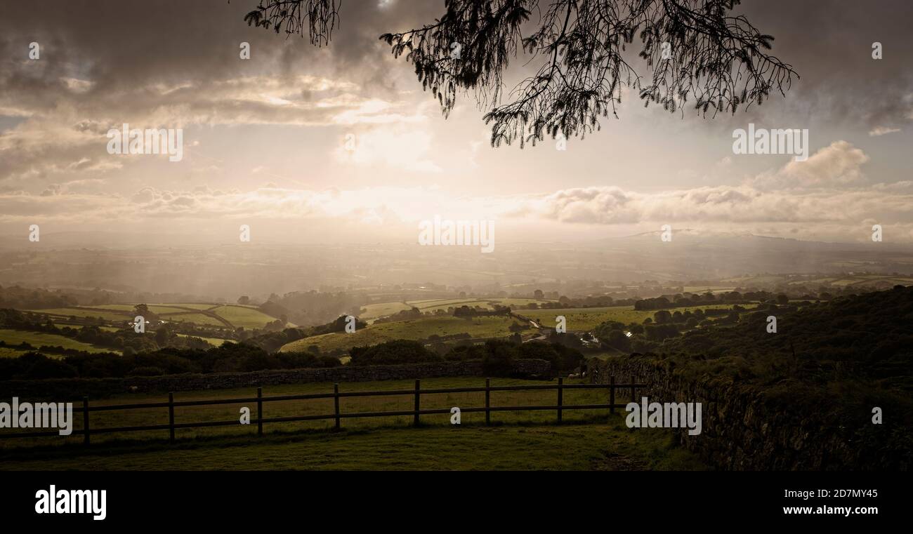 Moody light over farmland from the eastern edge of Bodmin Moor, Minions, Cornwall, England, UK. Stock Photo