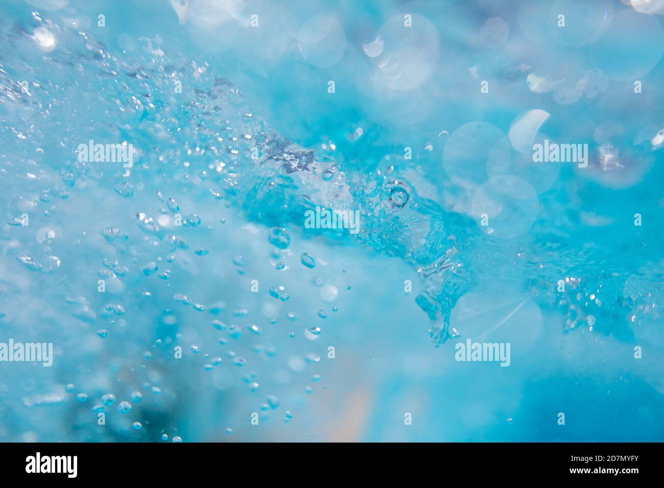 Beautiful water waves -  Splashed water wave in clean blue water, clean filtered water ready for drinking Stock Photo