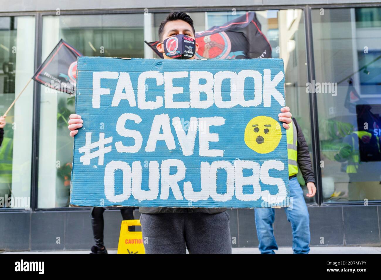 23 October 2020, London. UK. Agency cleaning staff employed at the offices of Facebook demonstrate against proposed redundancies and cuts in working hours while complying with social distancing regulations. Stock Photo