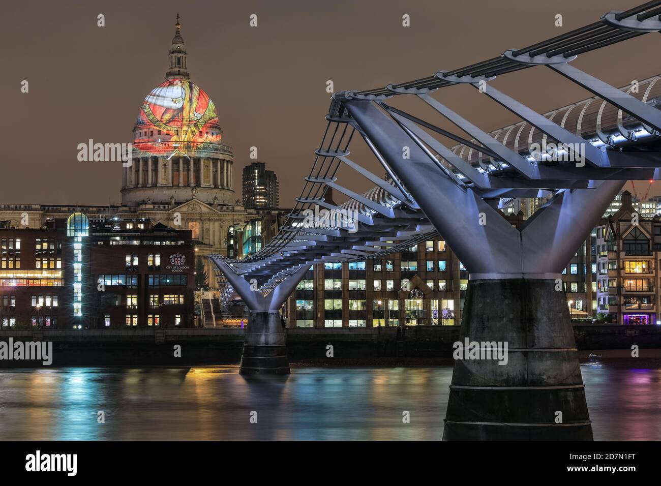 The dome of St Paul's Cathedral with Millennium Bridge, from across the River Thames, with projection of William Blake’s ‘Ancient of Days’, London, UK Stock Photo