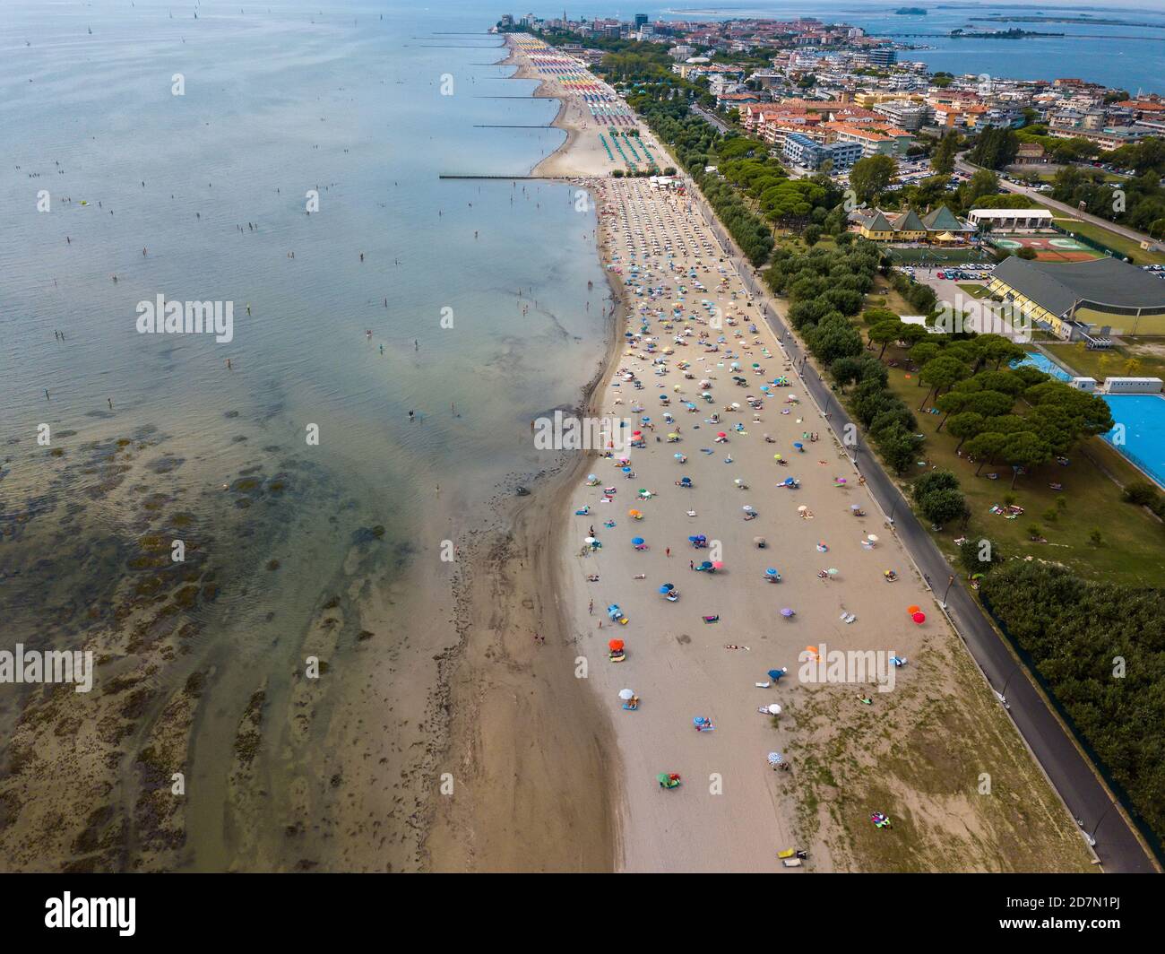 Aerial view of unidentifiable people enjoying summer at the beach of Grado in the province of Gorizia at the Northern Adriatic Sea Stock Photo