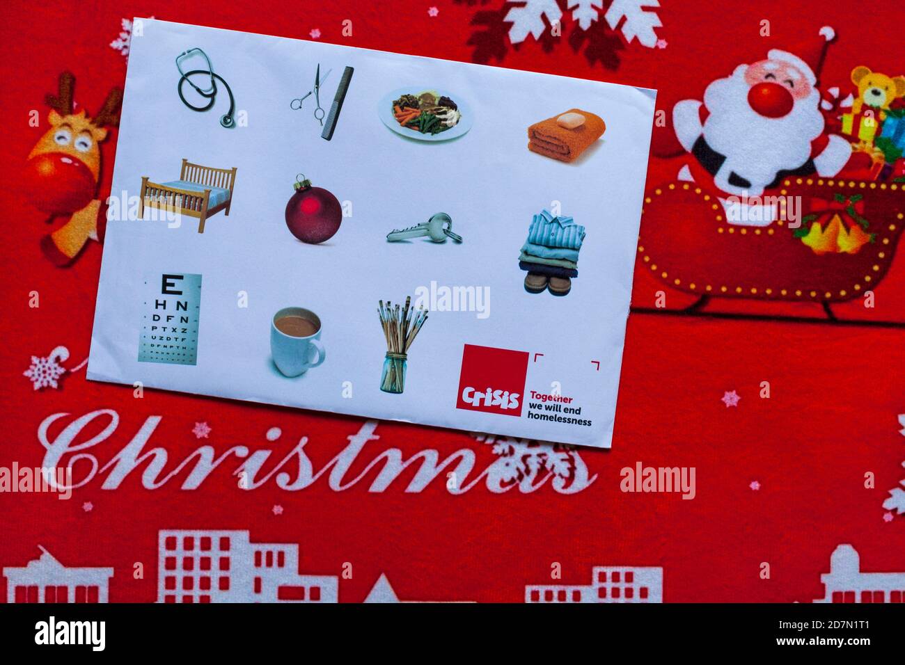 Post on Christmas mat - charity appeal, Crisis together we will end homelessness Stock Photo