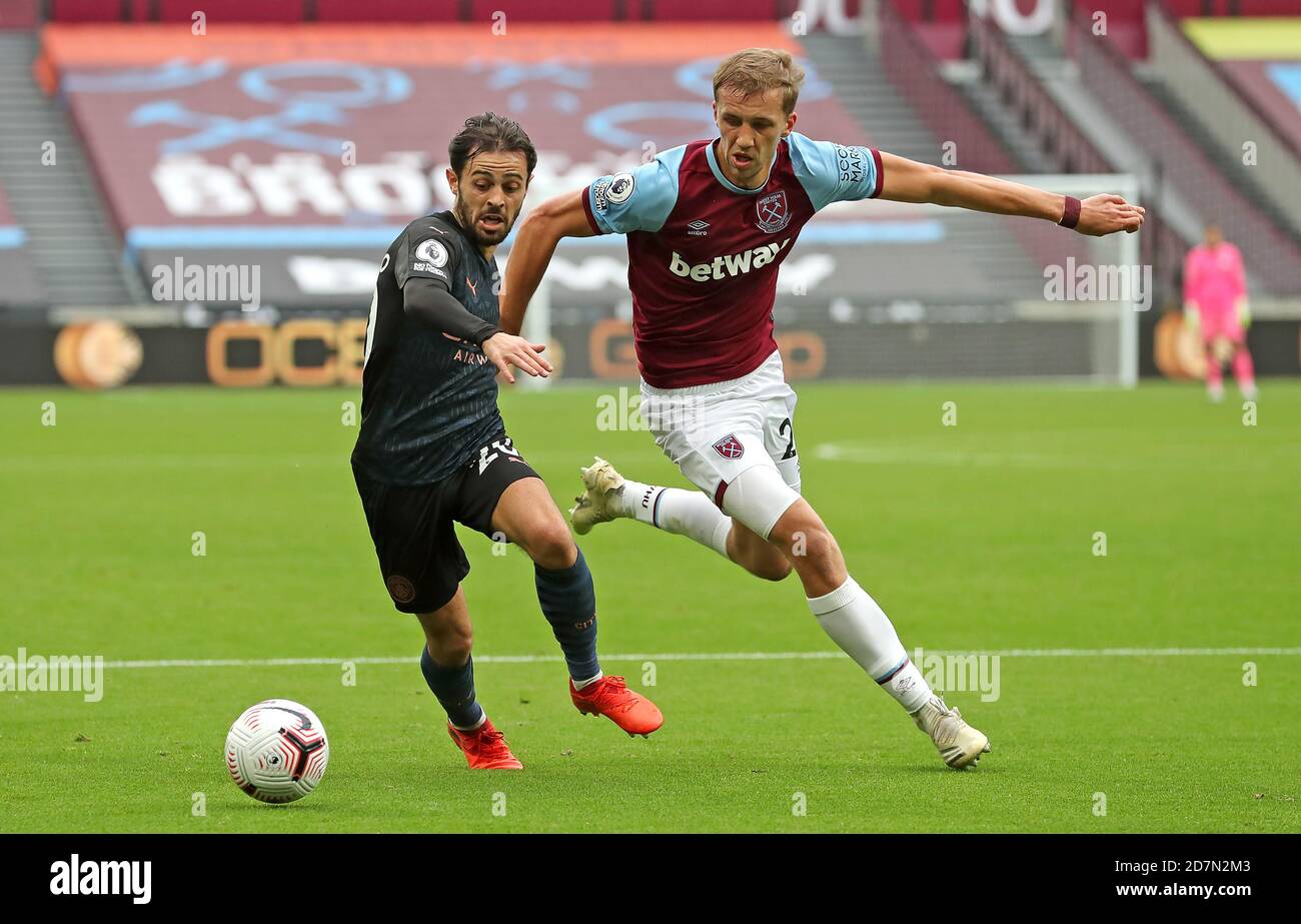 Manchester City's Bernardo Silva (left) and West Ham United's Tomas