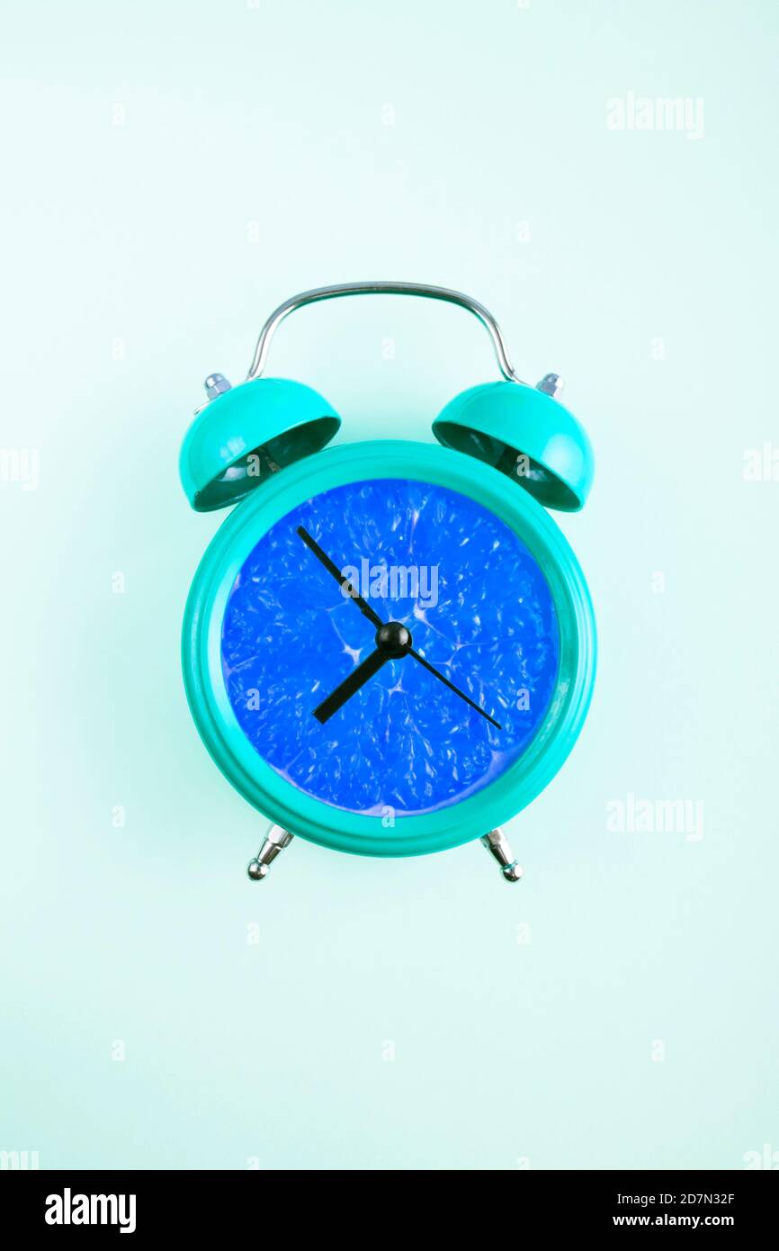 A retro style alarm clock in blue Stock Photo Alamy