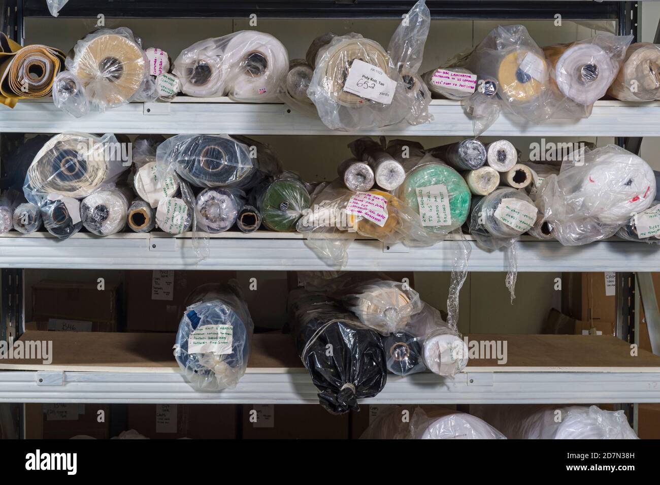 Rolls of fabric on warehouse shelves, Philadelphia, USA Stock Photo