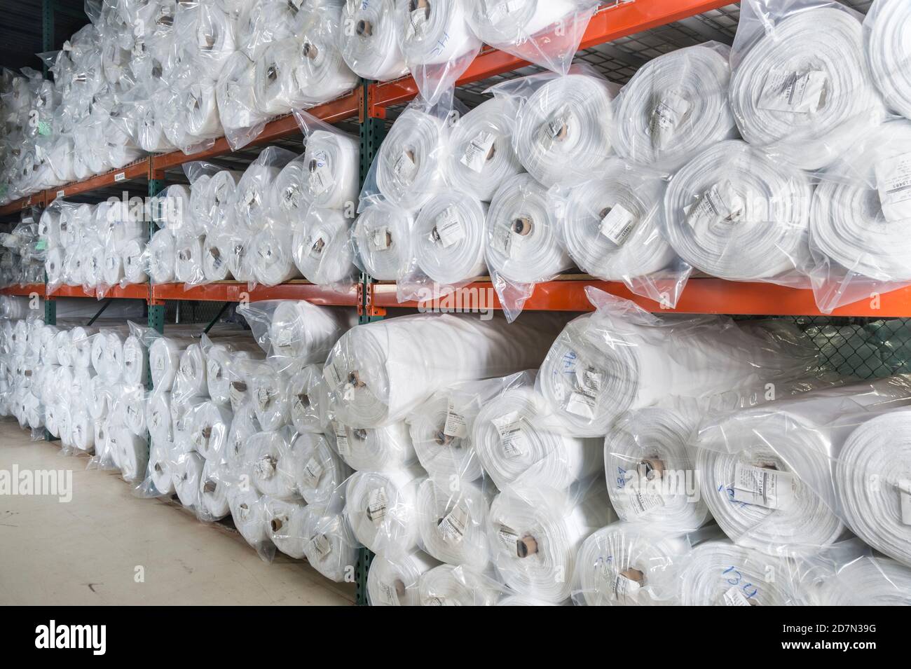 Rolls of fabric on warehouse shelves, Philadelphia, USA Stock Photo