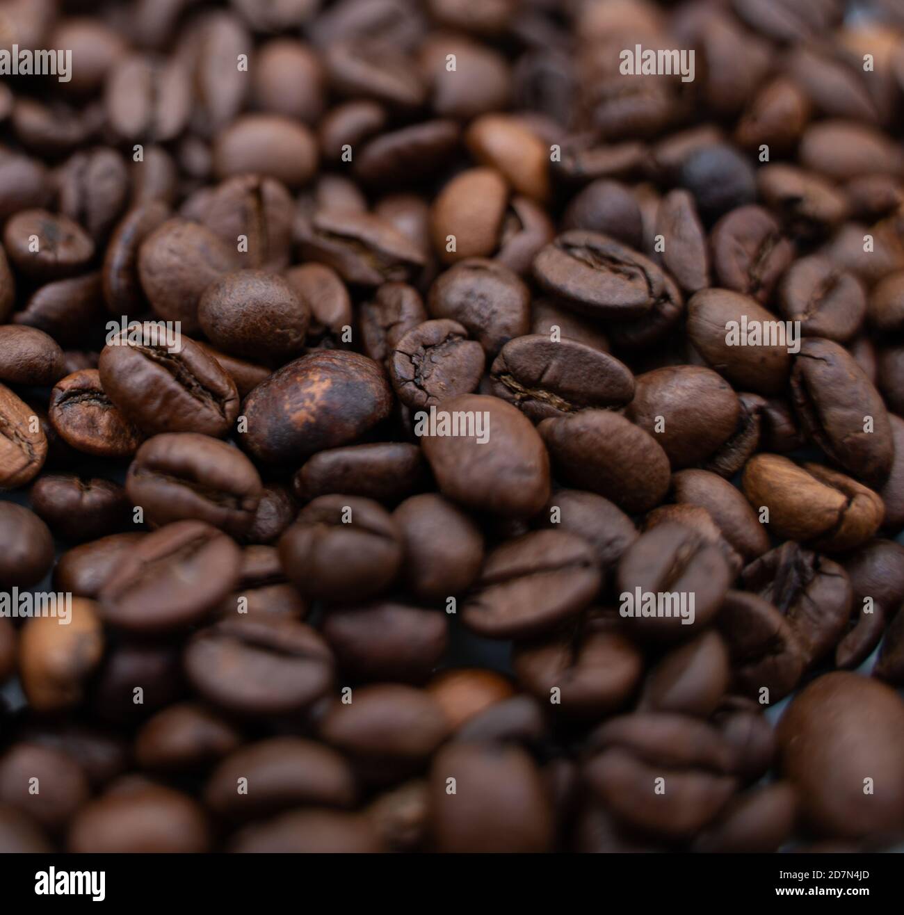 Background image with roasted brown coffee beans Stock Photo - Alamy