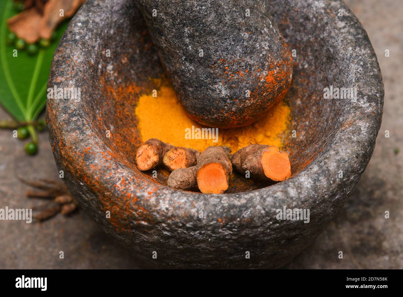 Turmeric a deep orange yellow powder and spices, Kerala India.Used for aroma, coloring and flavoring of food in Indian cuisine. Herbal antiseptic Stock Photo