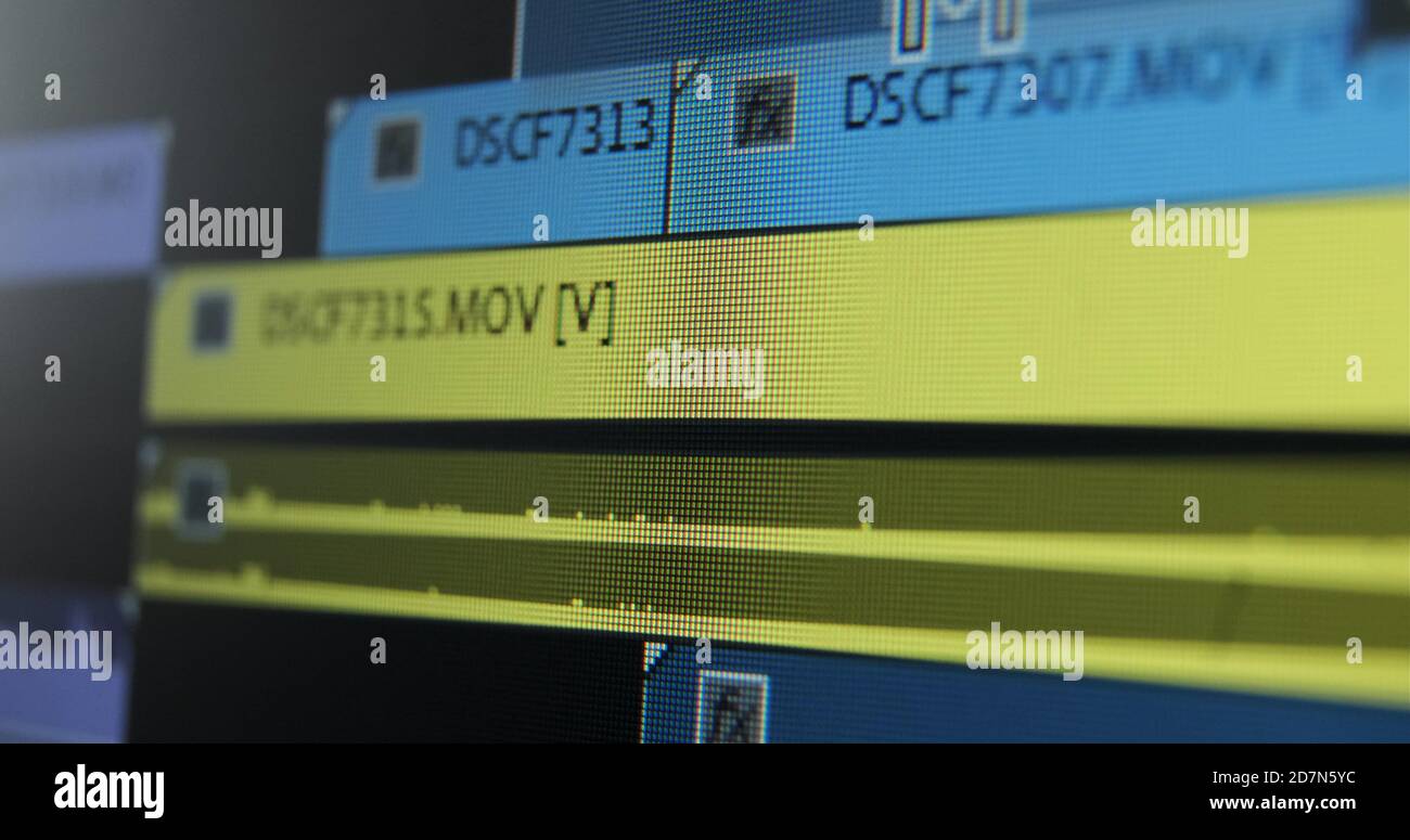 Movie editor adds footages on timeline doing video editing of project in computer program extreme close view Stock Photo