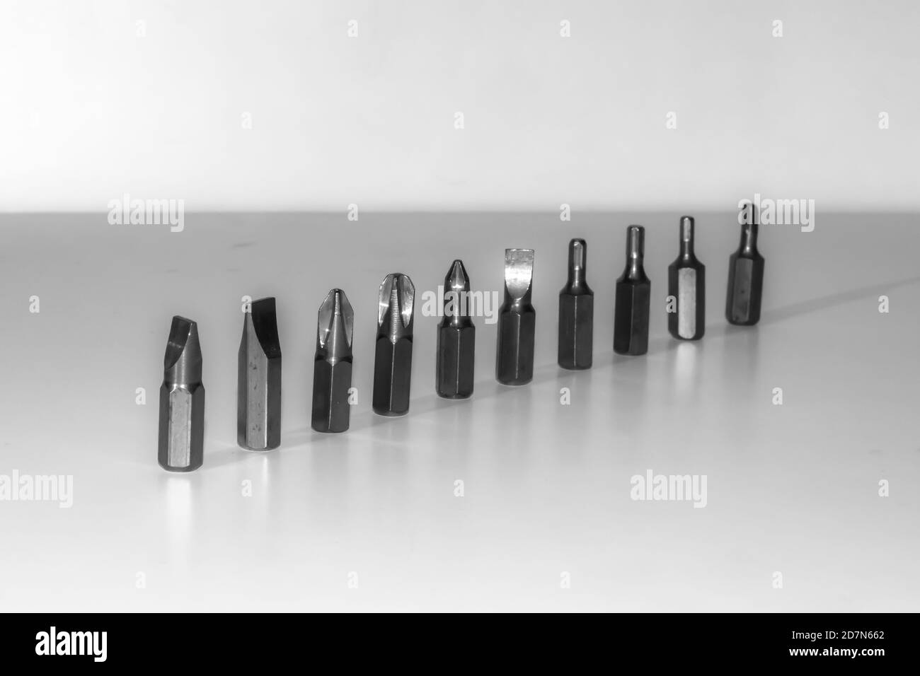 Different types of screw bits of screwdriver isolated on white