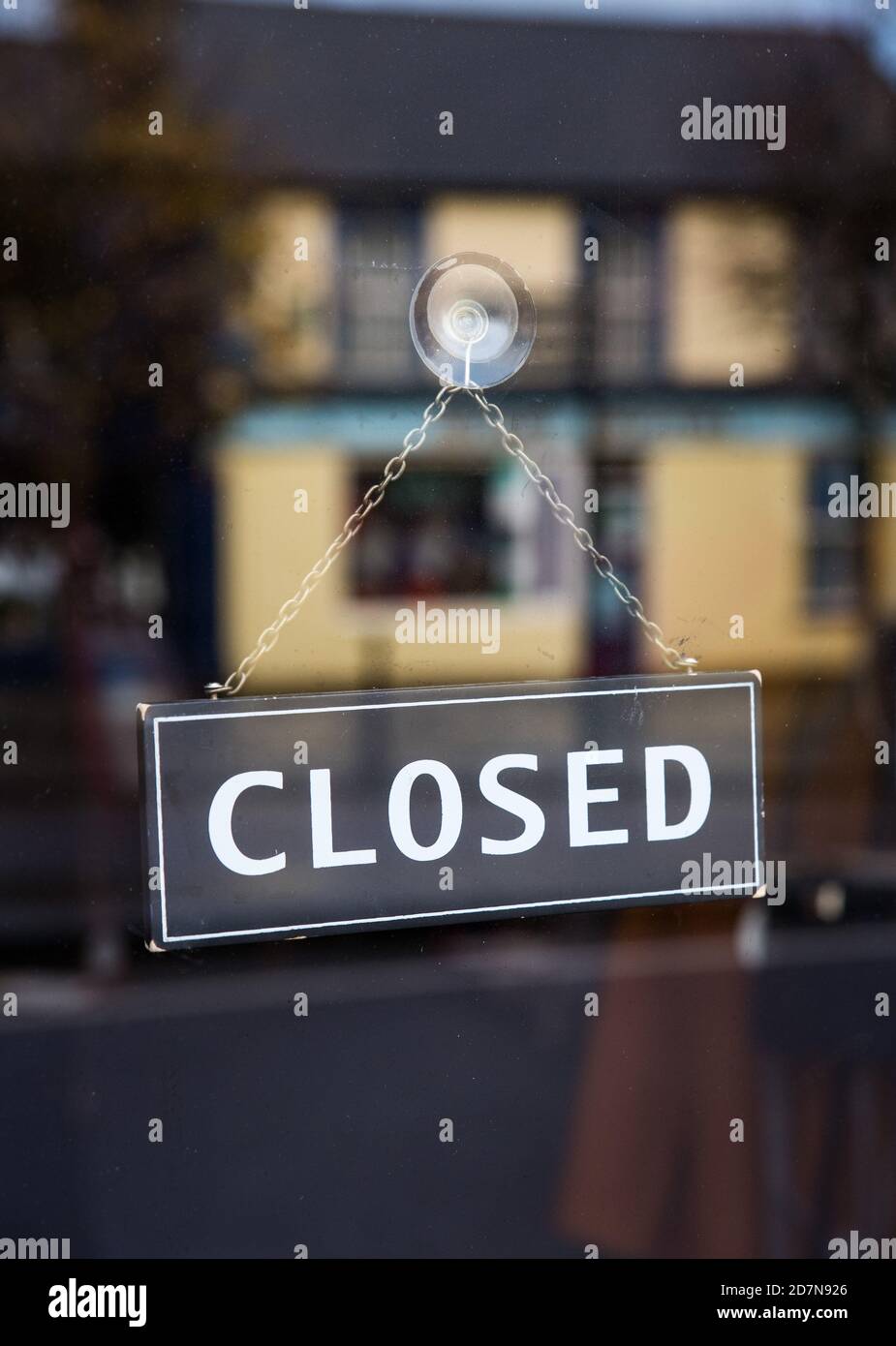 Closed sign in store window Stock Photo Alamy