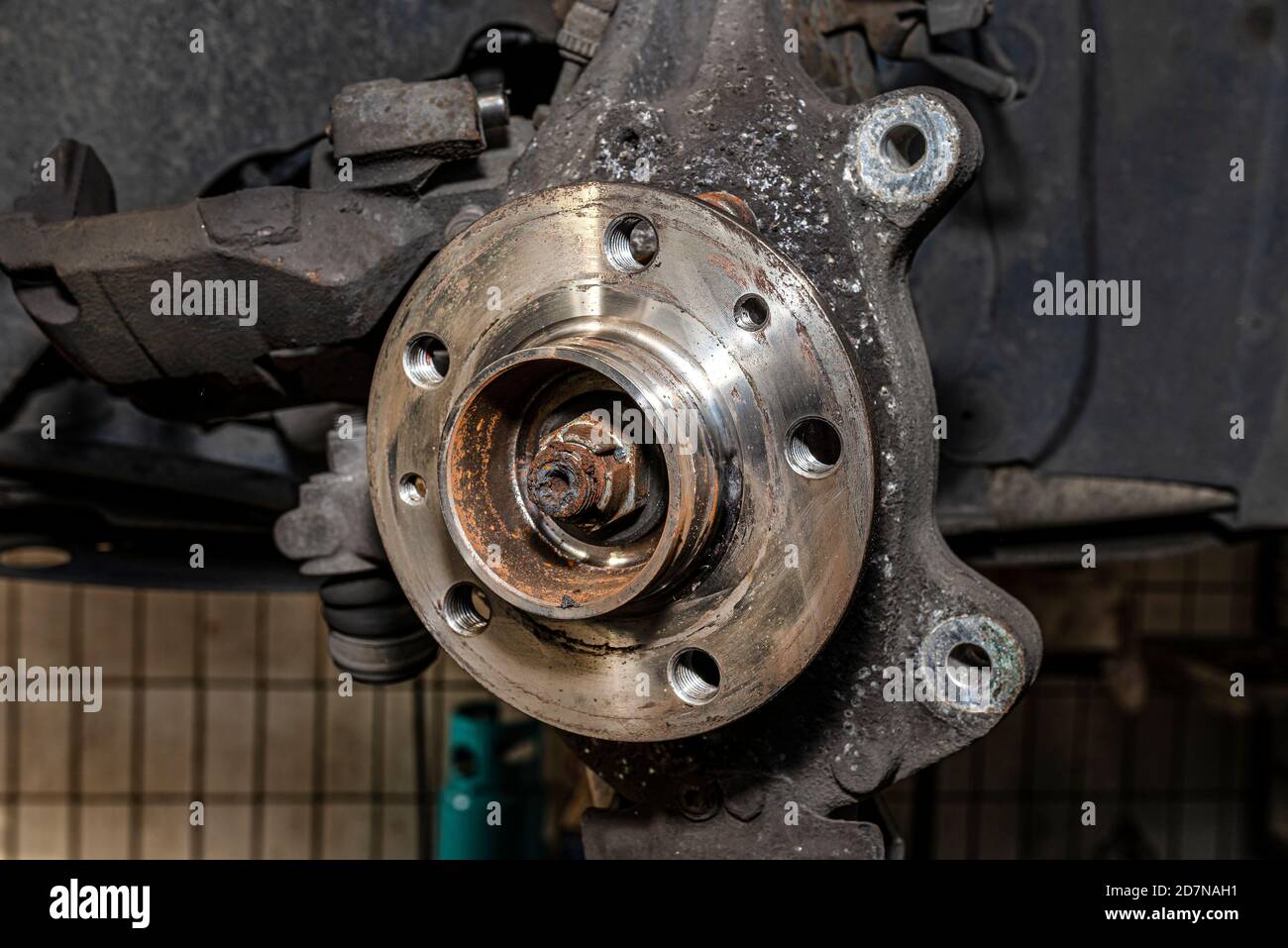New front hub mounted in a car on a steering knuckle without a brake