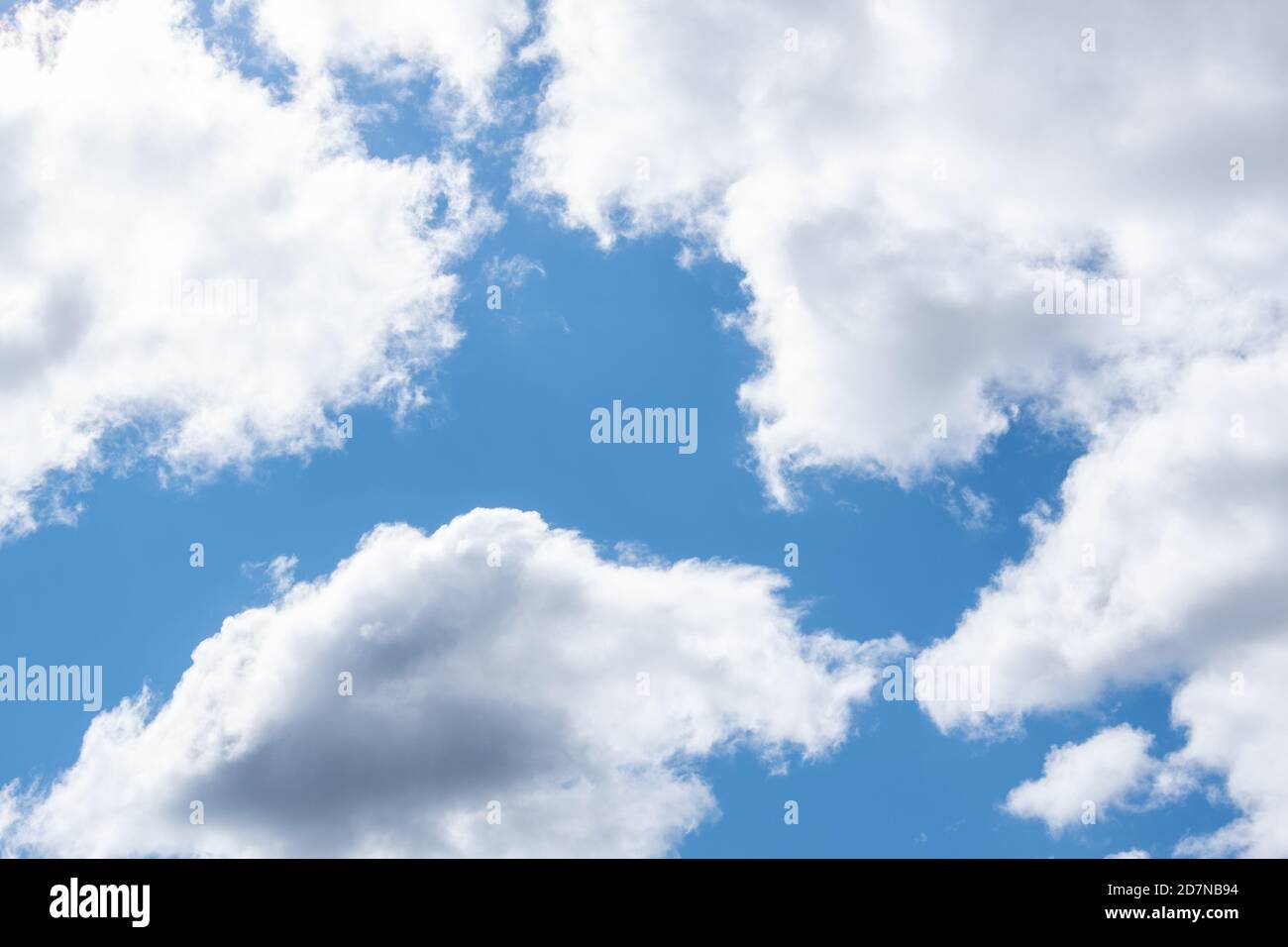 Blue sky and white cumulus clouds, natural background Stock Photo - Alamy