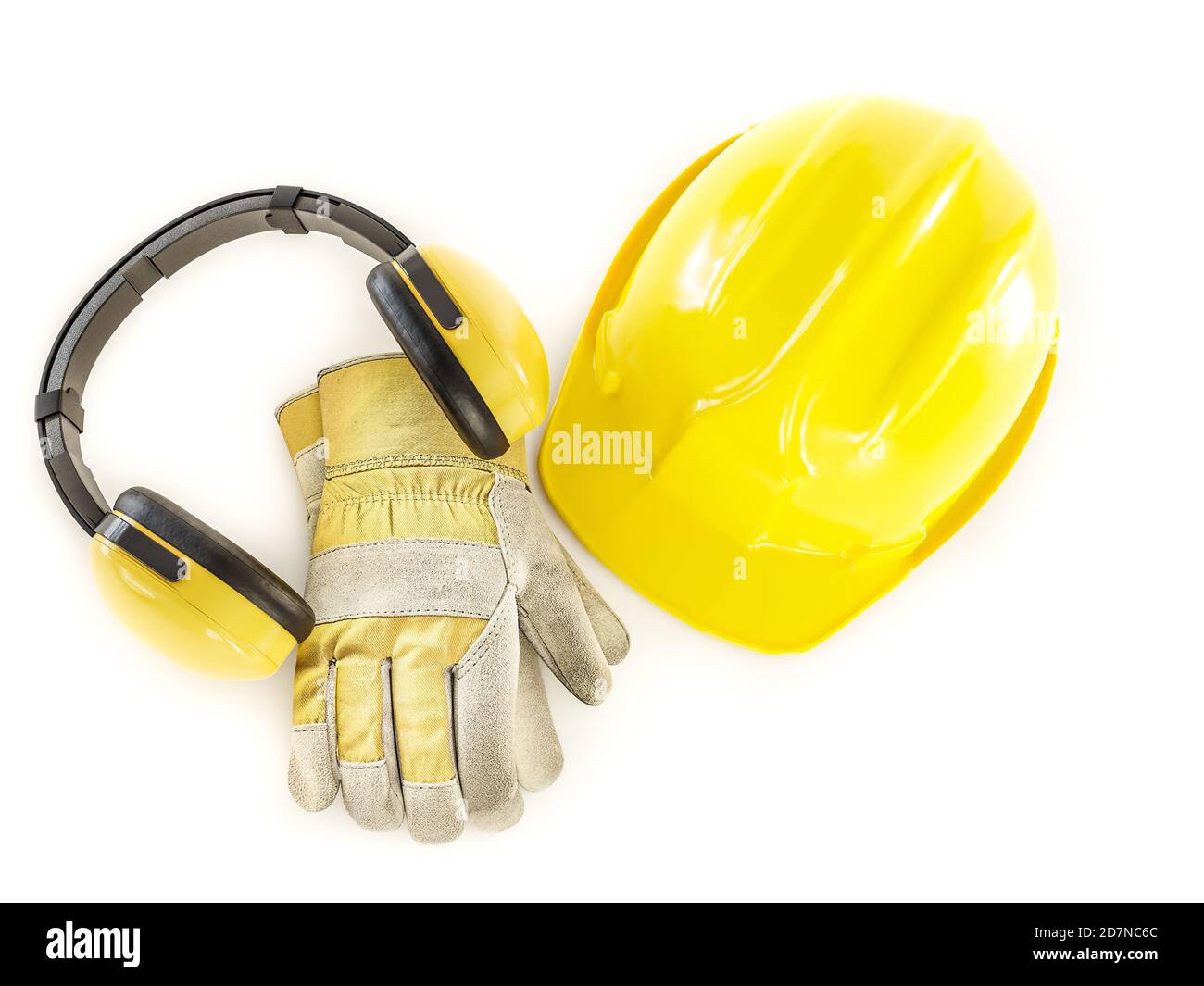 Yellow hard hat, leather protective gloves and earmuffs shot on white