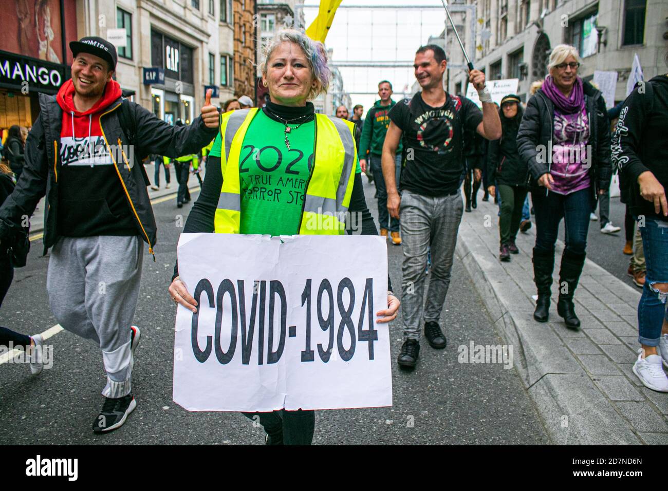 LONDON,UK 24 October 2020. Hundreds of protesters under Unite for Freedom and Save our Rights march through Oxford Street with placards against vaccinations and mandatory facemasks to demand an end the lockdown. Protesters believe that the virus is a hoax and is a way for the government to control and manipulate the public by taking away their freedoms. Credit: amer ghazzal/Alamy Live News Stock Photo