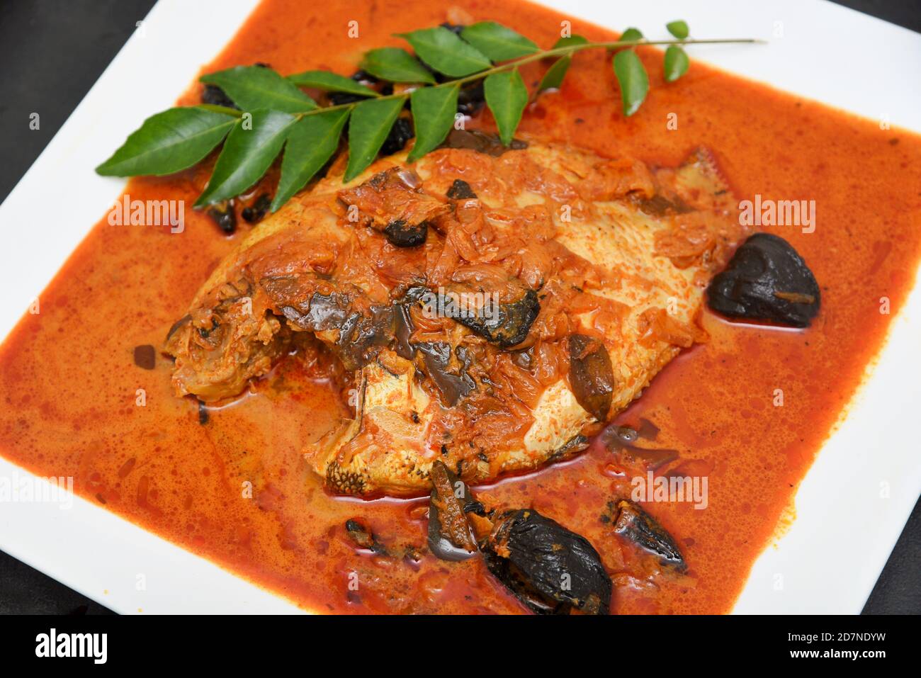 Spicy hot Kerala fish curry, Indian  fish curry popular in Goan Bengali and Sri lanka. Lankan fish curry. red curry fried fish vindaloo. King fish Stock Photo