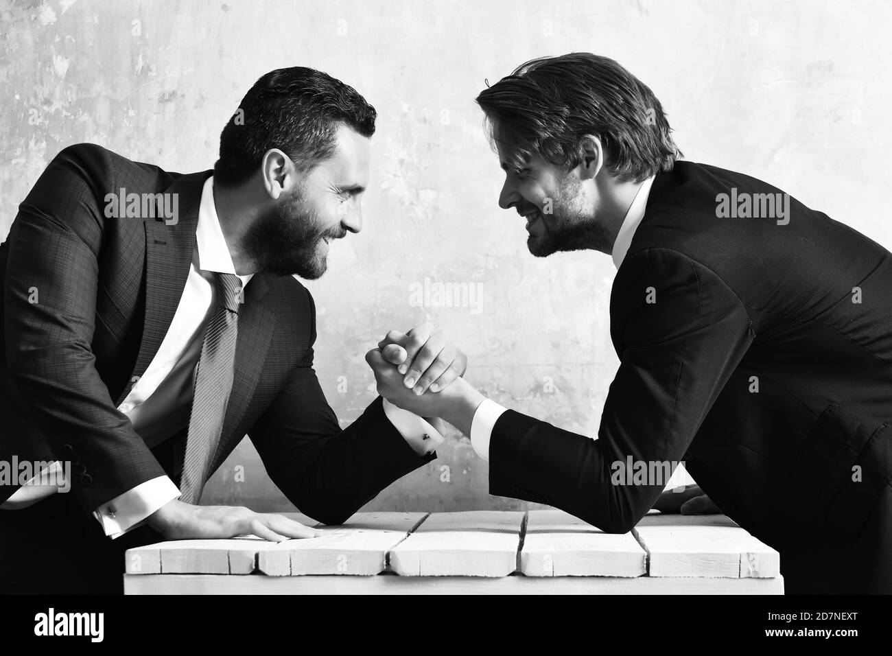 Challenge teamwork concept. Businessmen arm wrestling Stock Photo Alamy