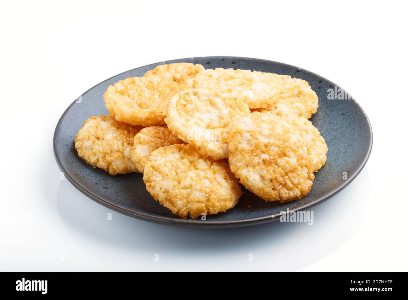 Traditional japanese rice chips cookies with honey and soy sauce on a ...