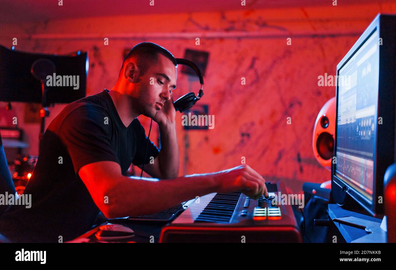 Professional sound engineer working and mixing music indoors in the studio Stock Photo Alamy