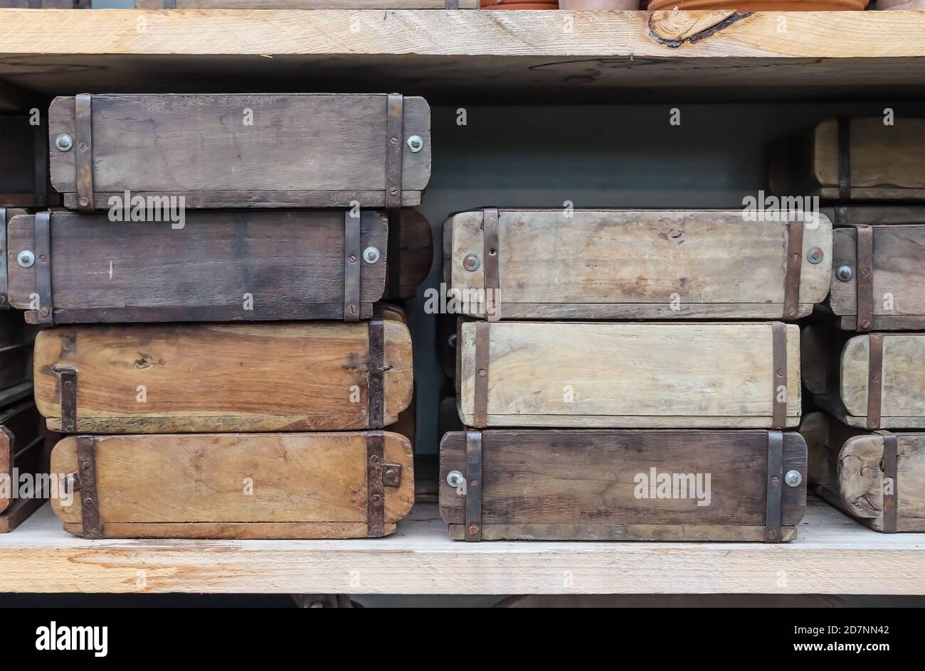 Vintage wooden crates in a shelf for sale in a small shop Stock Photo -  Alamy