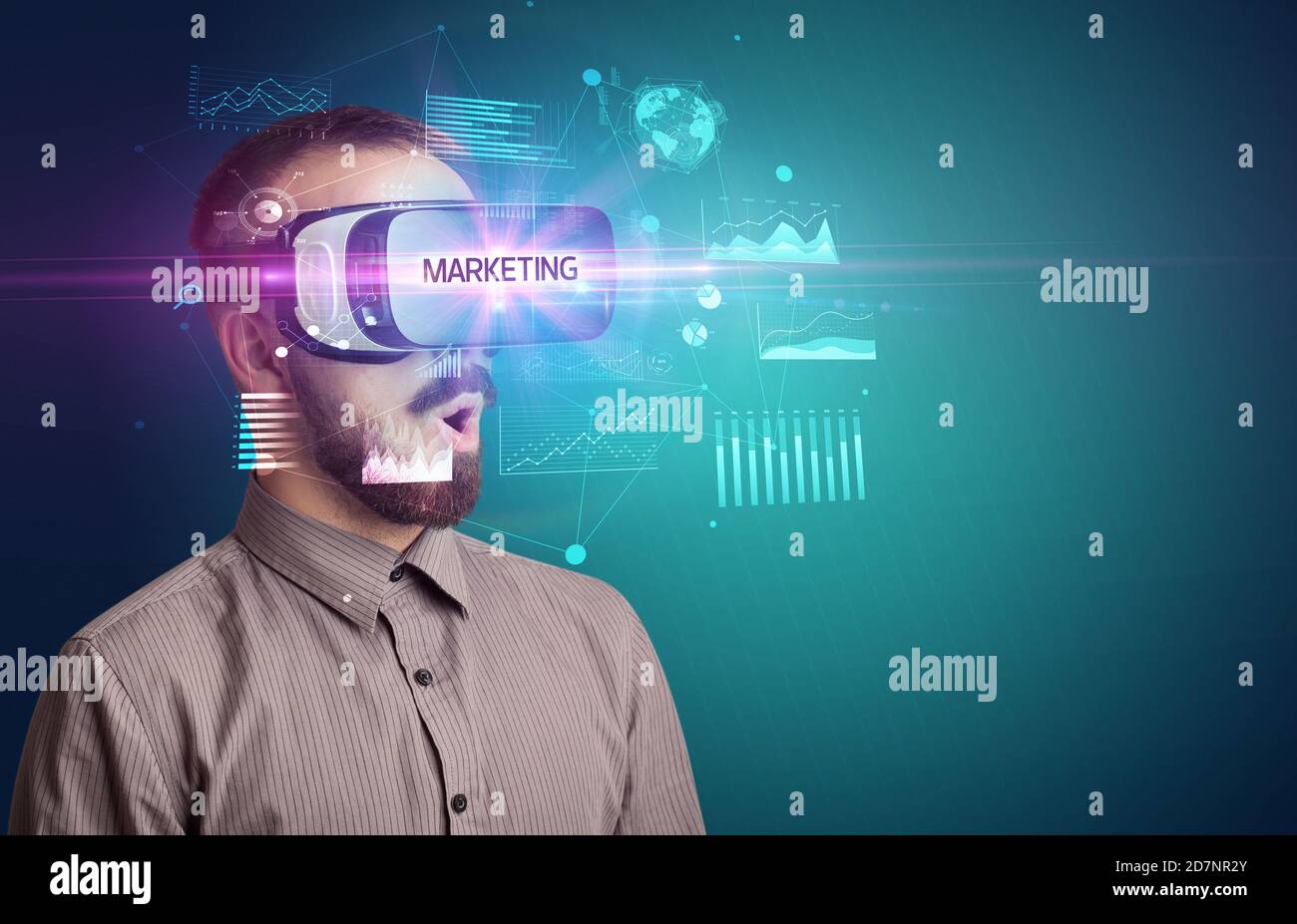 Businessman looking through Virtual Reality glasses with MARKETING ...