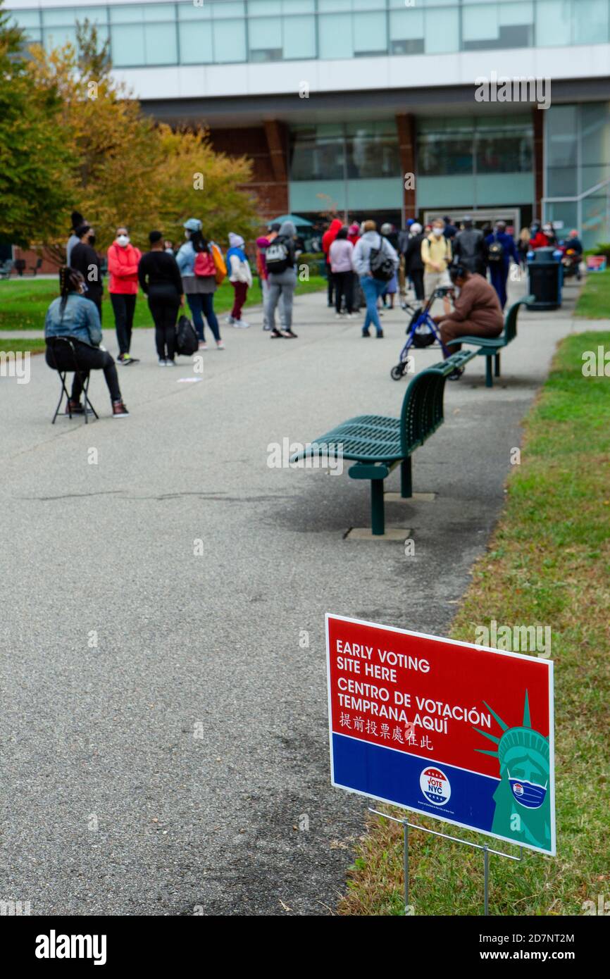 Brooklyn, NY, USA. 24th Oct, 2020. A line of people eager to vote stretched for 0.6 mile (1 km) a half hour after the polls opened on the first day of early voting in New York. The doors at the early voting location at Brooklyn College in the Midwood neighborhood opened for voters at 10:00 AM, and a poll worker reported that the first person to arrive got to the doors at 4:30 that morning. The entrance to the polling place at Brooklen College. Credit: Ed Lefkowicz/Alamy Live News Stock Photo