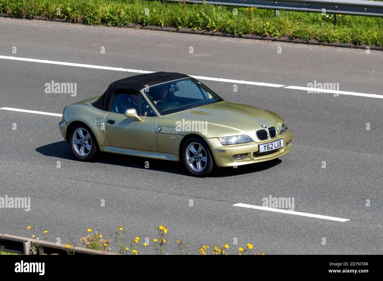 2001 green BMW Z3 sports car; Vehicular traffic, moving vehicles, cars, vehicle driving on UK roads, motors, motoring on the M6 motorway highway UK road network. Stock Photo