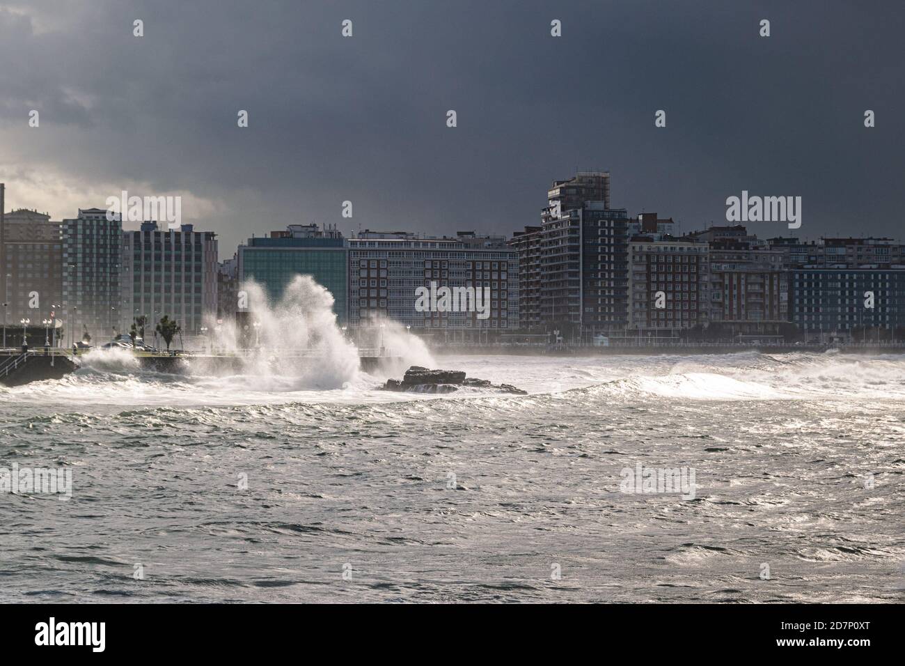 Waves crashing at the coast of Gijon, Asturias, Spain. Stock Photo