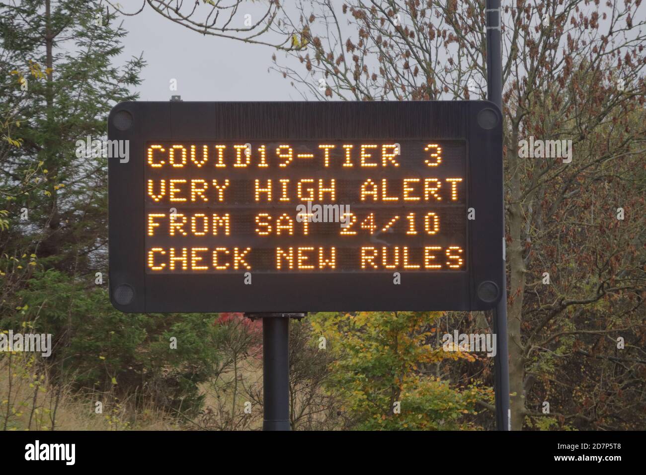 an electronic variable message  road side traffic sign showing coronavirus Tier 3 information and advice for Rotherham Stock Photo