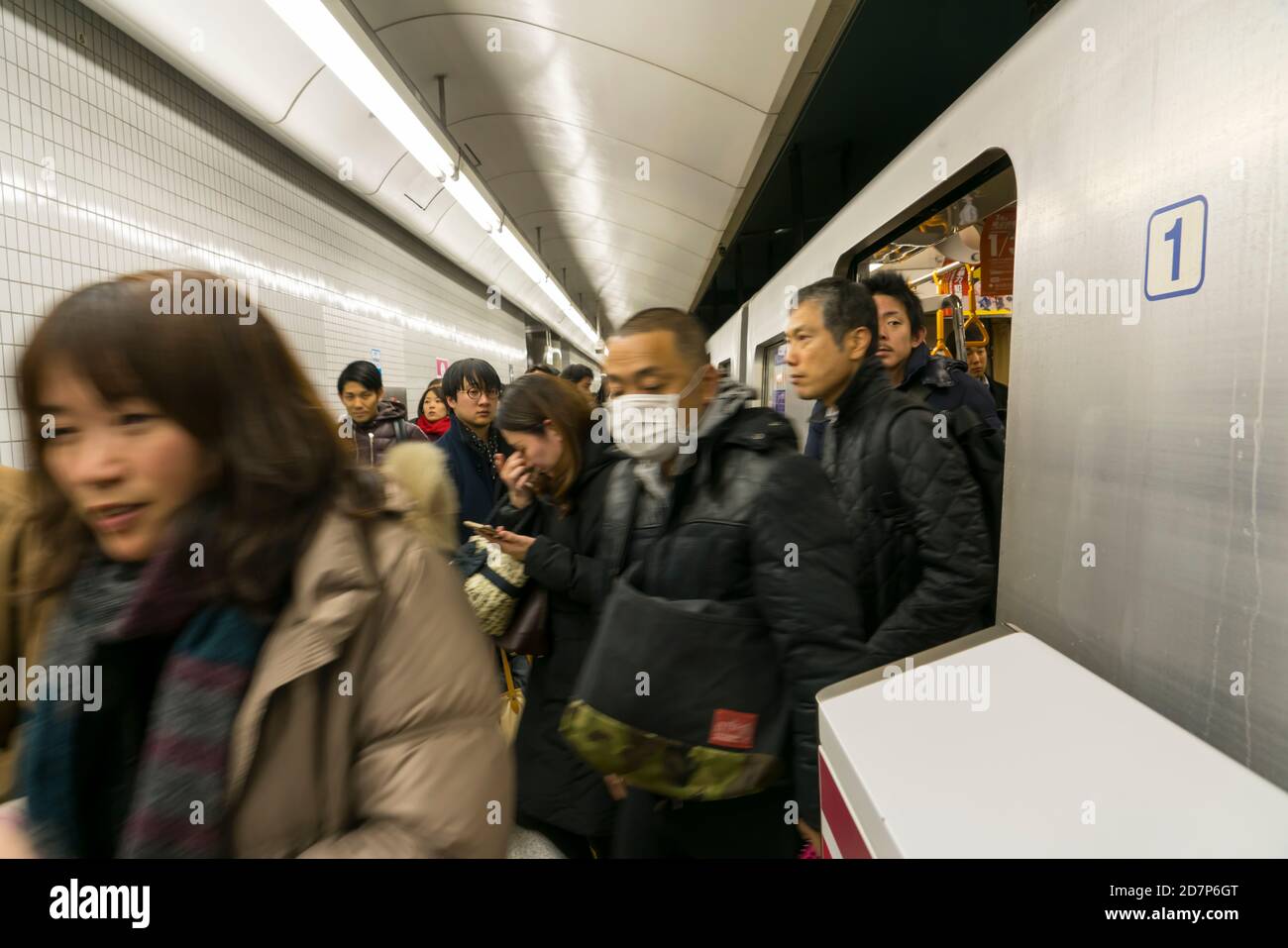 Commuters get out from the Toei Oedo Line at Morishita Station at Tokyo ...