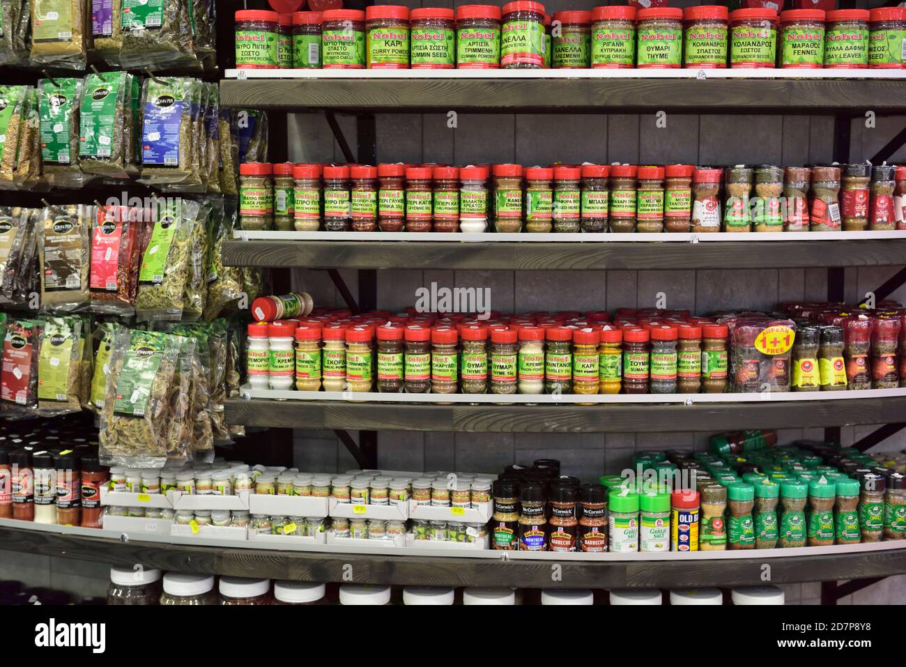Herbs and spices in jars and bags on display in store Stock Photo Alamy